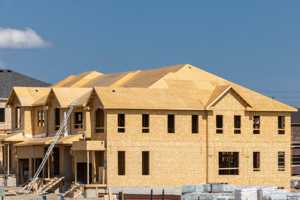 Plywood and oriented strand board or chip board roof and exterior wall sheathing of a residential construction project with many windows openings