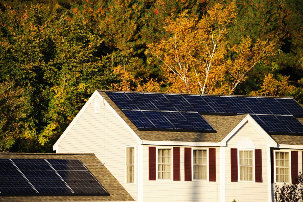 solar panel installed on the house roof with autumn trees