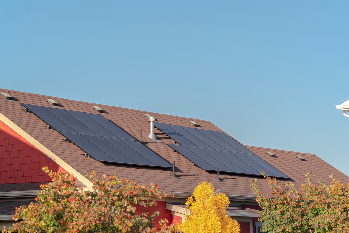 Photovoltaic solar panels on a house roof for converting the energy of the sun into green electricity