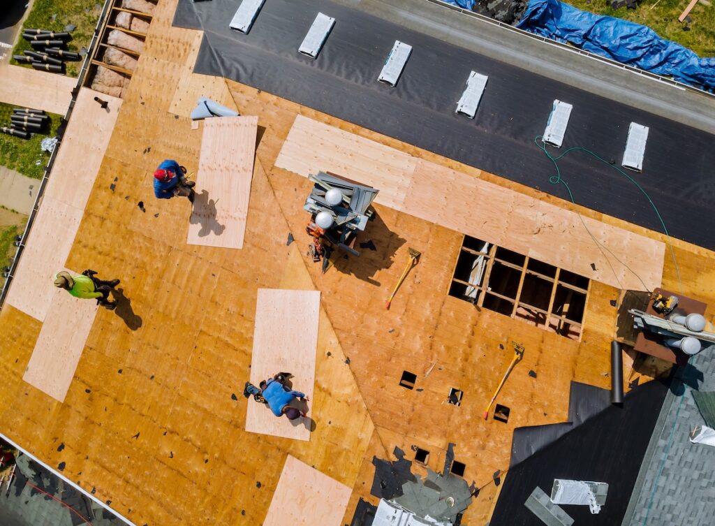 roof underlayment Removal of old roof replacement with new shingles of an apartment building