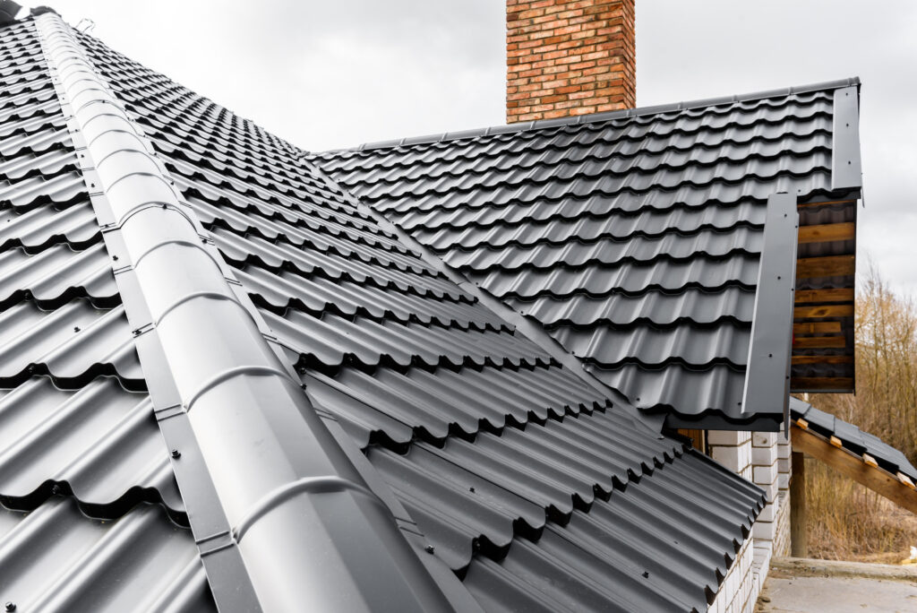 metal roof cost Construction of the roof of the house. Metal tiles.