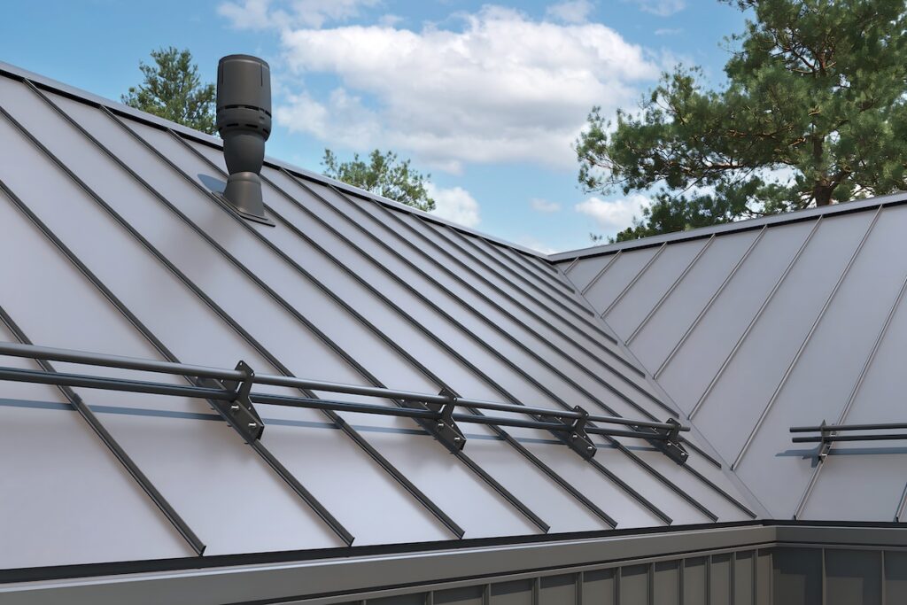 Close-up house retro roof panel with standing seam and fasteners. Classic style black metal panel with rebate joint. Modern galvanized steel roofing sheet with ribs. roofing. Building's covering
