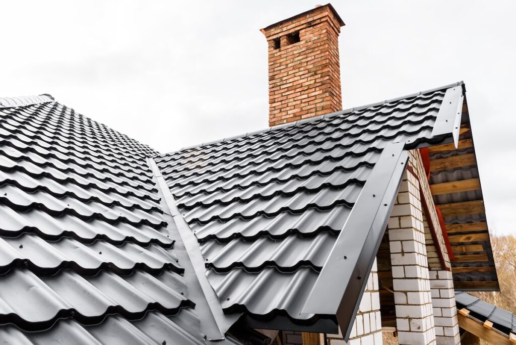 types of metal roofing Construction of the roof of the house. Metal tiles.